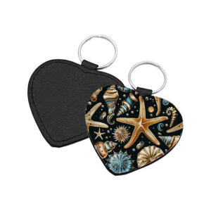 Portachiavi a forma di Cuore CP-0028 in pelle PU con grafica marina a stelle marine e conchiglie dorate e blu ottanio su sfondo nero, retro nero in pelle e anello in acciaio