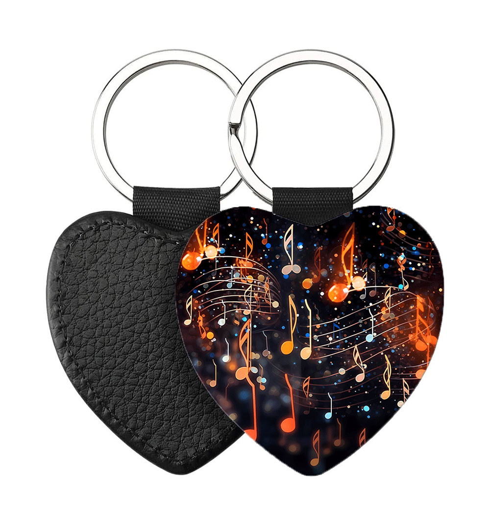 Portachiavi Cuore CP-0048 in pelle PU con grafica di note musicali e pentagramma brillante su sfondo scuro, retro nero in pelle e anello in acciaio